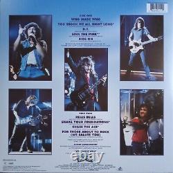 Angus Young a signé l'album vinyle Ac/dc Who Made Who
