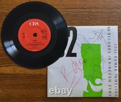 Disque vinyle entièrement signé par U2 avec certificat d'authenticité d'Epperson
