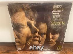 L'album Début des Doors signé par les 4 : Morrison, Manzarek, Krieger, Densmore