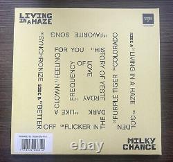 Vinyle LP signé et autographié par le groupe Milky Chance - Living In A Haze. Avec certificat d'authenticité (COA).